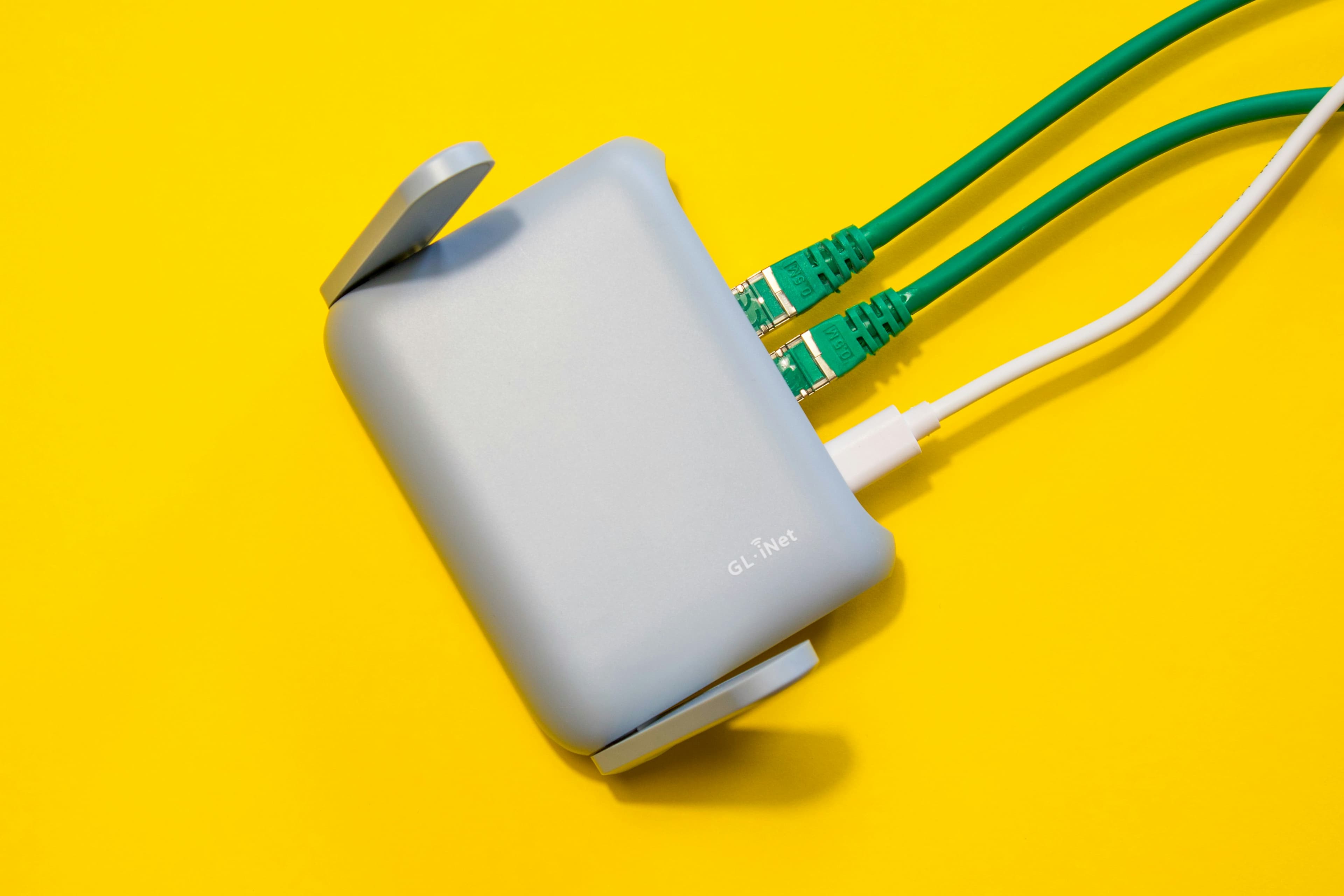 A home Wi-Fi router connected with cables